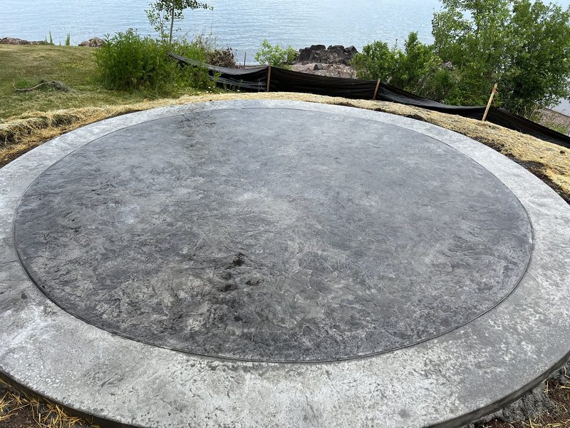 Circular stamped concrete pad on Lake Superior